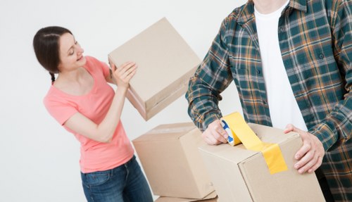 Professional movers carrying furniture during a same-day relocation