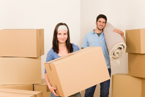 Professional movers preparing a grand piano for transport in Blackheath
